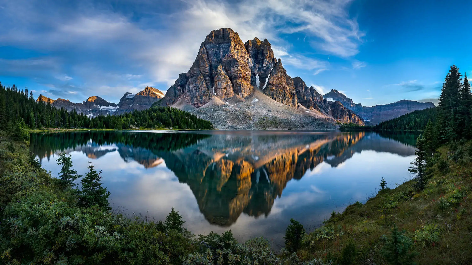 Mountain reflection in a lake with a clear blue sky